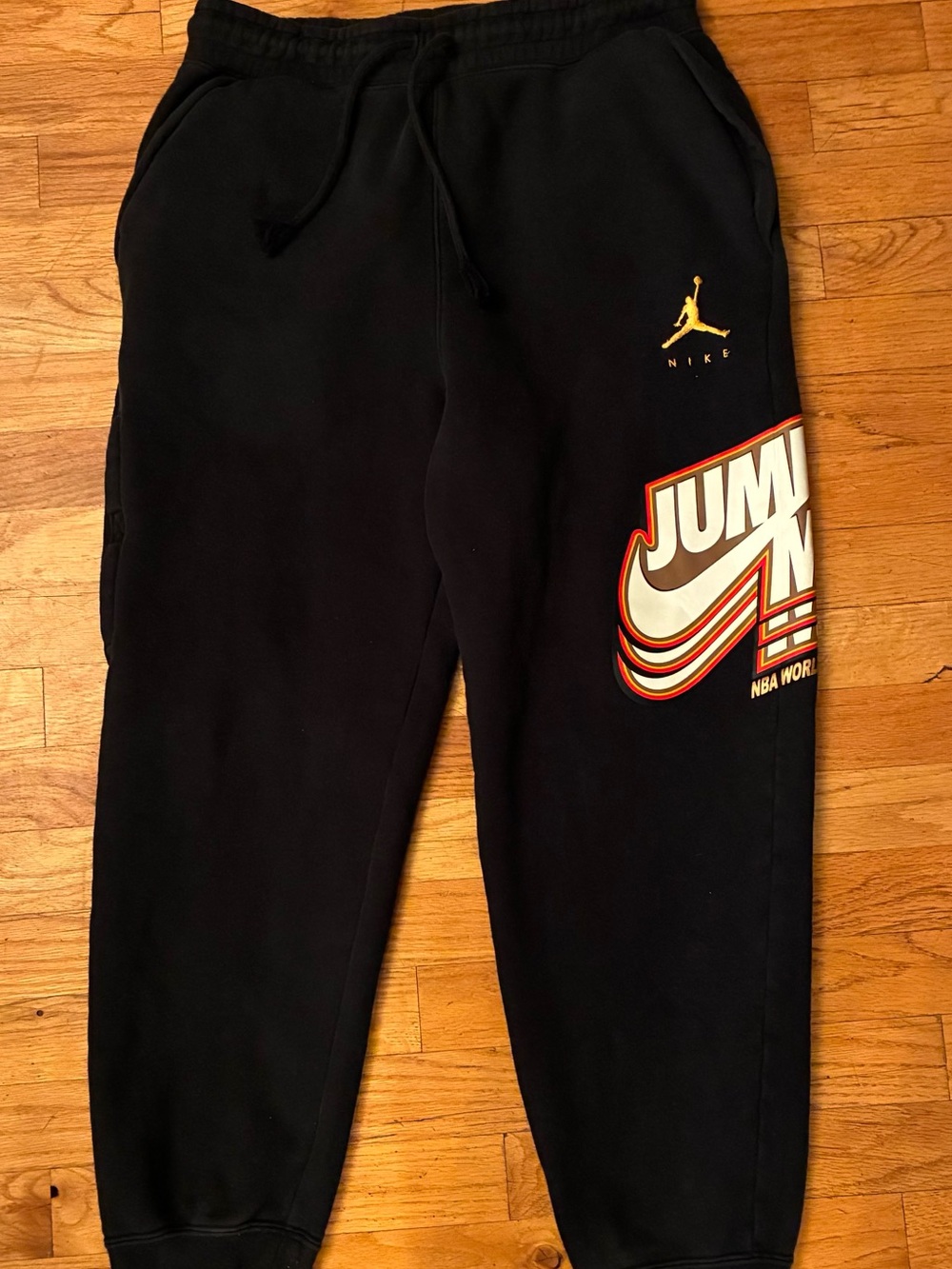 Nike Black Jogger Pants with Yellow Jumpman & Red-Trim Graphic